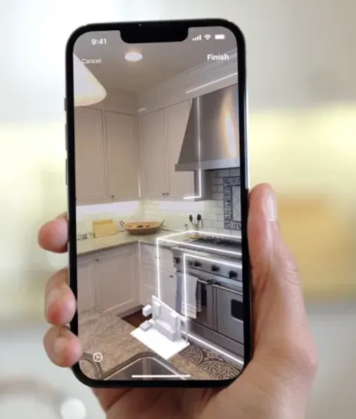 A phone scanning a kitchen with LiDAR, the countertop and range outlined